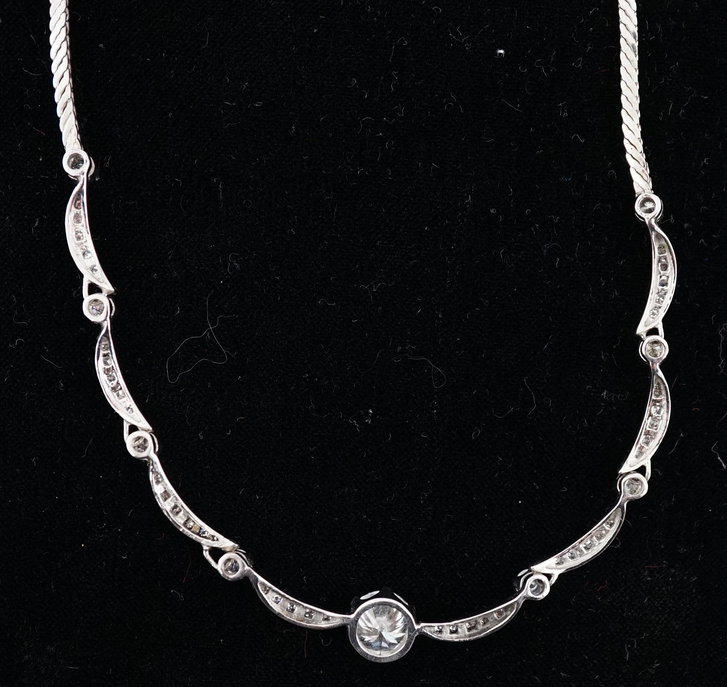 A modern 18ct white gold and diamond cluster set necklace